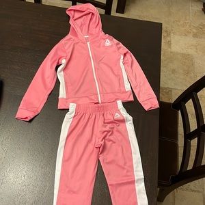 Like new, never worn. Pink two piece.